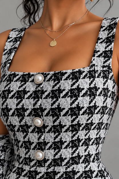 Close-up of black and white houndstooth tweed dress details